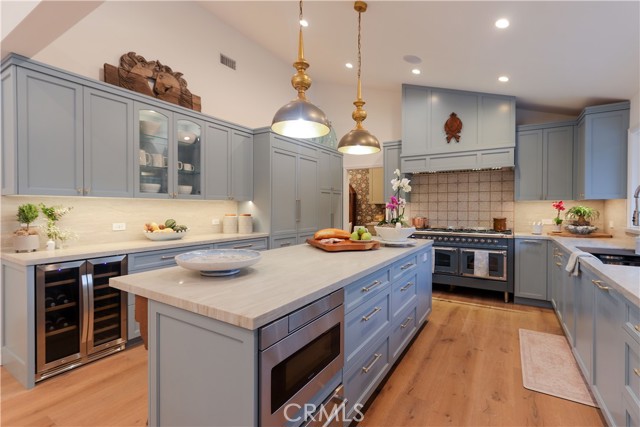 A one-of-a-kind, bespoke kitchen with 48\" Thermador refrigerator, ILVE Nostagie II 60\", 9 burner range, built-in beverage cooler and under-counter microwave.