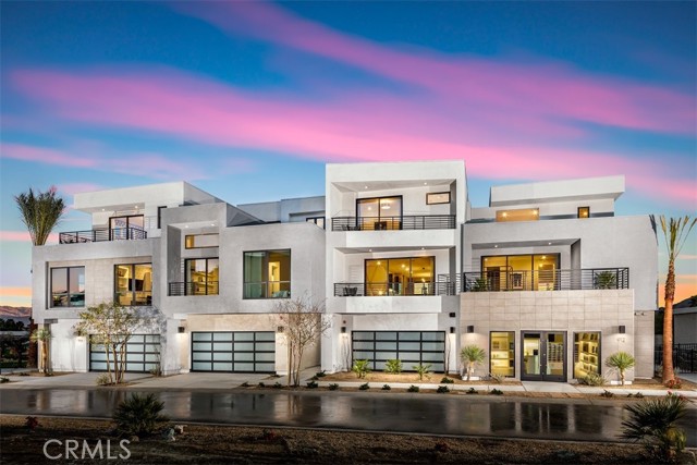 920 Galaxy Drive Palm Springs, California The Final Brody Elite offered for sale at the premier Cody Place in Downtown Palm Springs! Luxury redefined with this stunning 3 story Brody Elite home design. You will be captivated the moment you enter with the jaw-dropping floating staircase with glass surround making an incredible first impression. Highly coveted end unit sharing only one common wall overlooking the community lap pool- this home features 2 bedrooms including an expansive primary bedroom with large deck, 2 and a half baths and loft. High-end finishes includes whole house upgraded bright white acrylic cabinets featuring the furniture package allowing cabinets to extend to ceiling and spice racks on both sides of the stove, split island in exotic Abbey wood finish, full slab Oceana quartz counters with upgraded backsplashes, upgraded primary bathroom shower with stunning 12x24 wall tile, upgraded first floor white Bianco Vetri high gloss tile in 24x24, Stria Maestro, and Simply Silver luxury vinyl plank flooring complete this masterpiece with patterned Berber carpet in primary and guest bedroom suite. Enjoy even more high end included features such as Anderson windows, Western Stacking doors, tankless water heater, prewire for electric vehicle, and 4.9 kW owned solar.