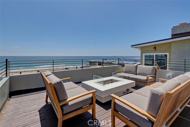 2110 Ocean Drive Manhattan Beach, California Property available May 16th. May 16- May 31st available for $9,000 per month. June 1st - June 30th available for $25,000 per month. July 1st-July 30th available $35,000 per month. August 1st - August 31st, available for $35,000 per month. September 1st- September 30th available for $18,500. October 1st- October 31st, available for $18,500. Location, location, location. This 4 bed, 3.5 bath is steps from the Manhattan Beach Strand and ocean. This beach tropical design home boasts an expansive 450 sq.ft. deck off living room with new solid teak couches, sofas, dining table for 6, fire pit, new BBQ, potted plants, speakers plus sand/white water and pier views. Top floor living includes gourmet kitchen opening up to dining and living area. Living area has white water and sand views including fireplace and bridge that connects to deck. Second level has three bedrooms and 2 baths including master suite. Ground level has two car garage parking with laundry room, plus den/4th bedroom with 3/4 bathroom. Beautiful entry with birds of paradise tropical landscaping. Property comes completely furnished. New lighting throughout, air conditioning, Sonos sound system, plus 5 flat screen TVs.