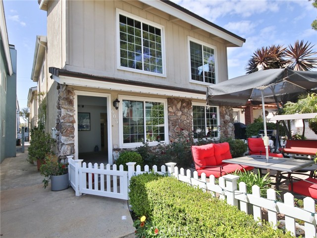 Front of duplex showing the entry and patio