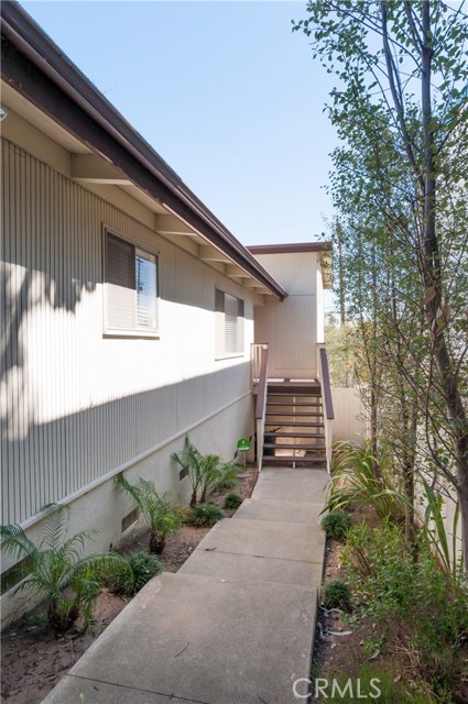 Sidewalk from front of property and steps up to front door.