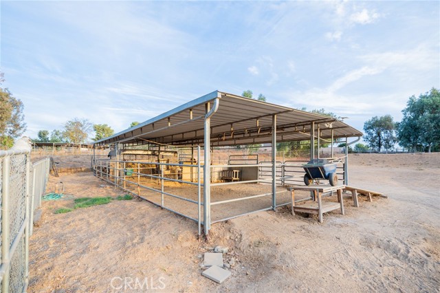 THIRD AREA IN THE BACK IS CROSS FENCED AND LIVESTOCK COVERED CORRALS WITH MANURE RAMP.