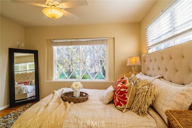 Master bedroom with charming touches and a view of the canyon.