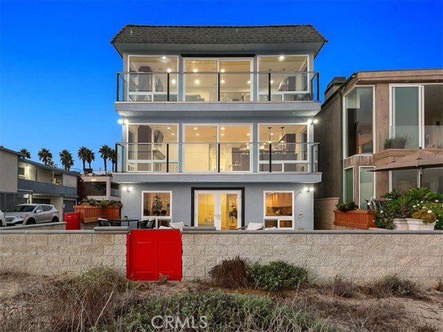 7310 W Oceanfront Newport Beach, California Dip your toes in the sand and surf with the best oceanfront living on W Oceanfront. There’s no better place for panoramic sunsets and views of white-water caps, the ocean and Catalina. As one of the tallest homes on W Oceanfront, there are 3 levels of living, with the structure currently configured as a duplex. This flexible structure could be converted to a single-family home or maybe convert the 1st floor to a 3rd unit as an ADU (buyer to confirm with the city). This home was remodeled to the studs in 2008 and features luxurious finishes and upgrades throughout. Entertainers will enjoy the private patio space with direct access to the beach and no boardwalk in front. The main level includes a finished 3-car garage, plus bathroom and bonus rooms with direct access to the patio. The 2nd floor is an owner's suite with a great room and kitchen, dining room, walk-in pantry, guest bath, plus oversized master suite with jumbo master closet and bathroom. The 3rd level features a great room and kitchen, 3 bedrooms and 2 full baths. The floorplan can be reconfigured for additional bedrooms if needed. The back stairway provides access all the way to the 4th level, which reveals a rooftop with dramatic views. The roof is brand new and carries a 30-year transferable warranty. This corner lot features ample parking, including a finished 3 car garage plus room for 2 additional cars. Per zoning, the property is eligible for Newport Beach short term rental (vacation rental) permit.