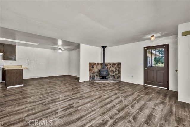 Open living area with wood stove.