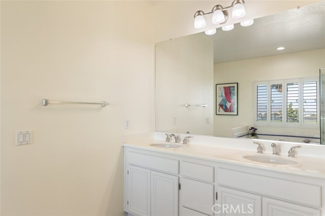 In the master bathroom, enjoy the convenience of double sinks for added functionality