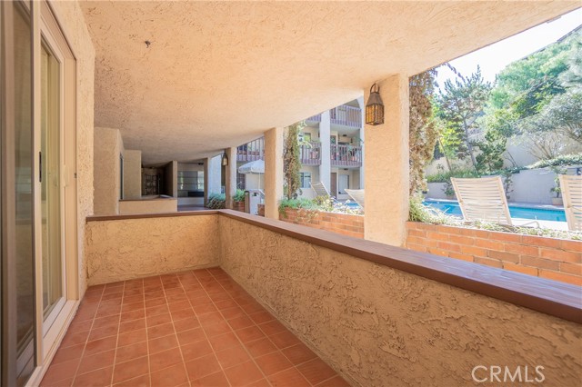 Patio overlooking community pool area