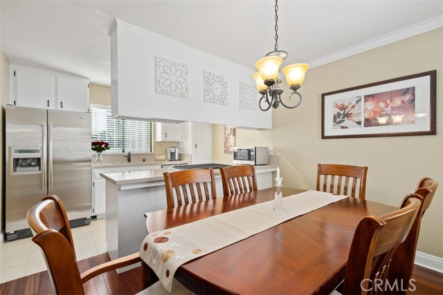 Formal dining-room, attached kitchen, warm colored paint