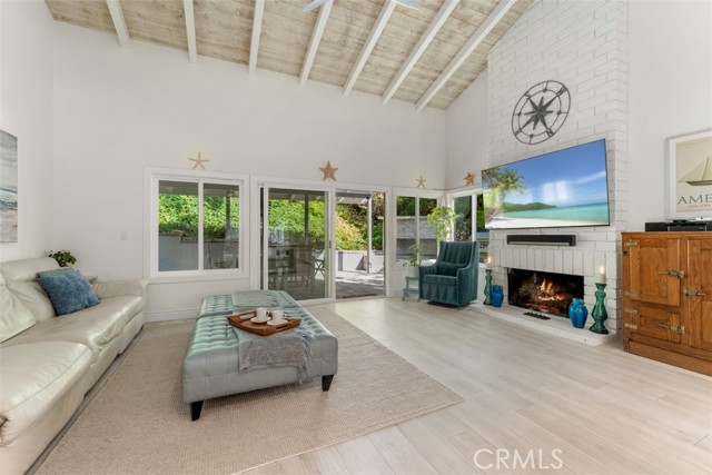 TV room open up to the private fenced in backyard