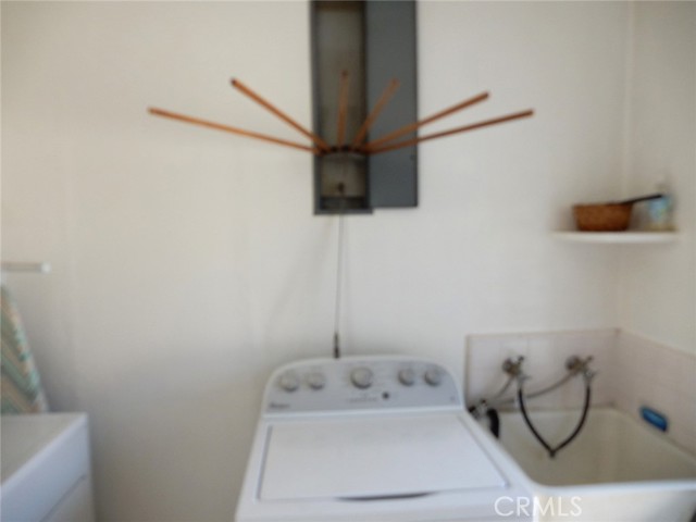 Great area above the washer/dryer for drying clothes.