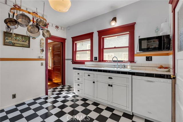 The kitchen features the original footprint and has been modified with vintage finishes.