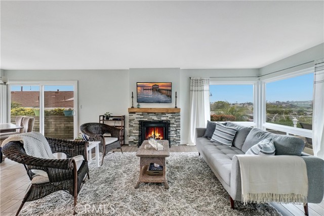 Gas fireplace with reclaimed wood mantle and views forever