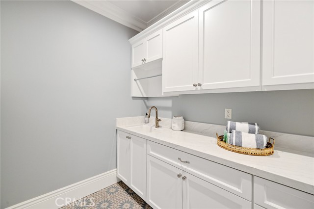 Spacious Laundry Room with an Abundance of Storage