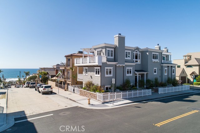 249 33rd Street Hermosa Beach, California Ocean views from every level! Situated on an oversized corner lot two blocks from the beach, this beautiful three-story Cape Cod home is located in one of the most desirable neighborhoods in Hermosa Beach. Featuring 4 bedrooms and 6 baths in 4,141 square feet of thoughtfully planned living space, the home is flooded with natural light and stunning views of Malibu, Palos Verdes, and Catalina. The lower level finds a comfortable media room with custom wet bar and patio access, allowing easy come and go for entertaining. A powder room is nearby, as is a guest/office suite with full bath. The center level offers a substantial master suite with fireplace, ocean-view balcony, master bath with separate soaking tub and shower and walk-in closet with custom built-ins. A large laundry room with sink and storage is conveniently located down the hall, along with two additional en suite bedrooms. The top floor is the centerpiece of this dwelling and provides a wonderful space for relaxing, entertaining and gathering with friends and family. A formal living room with fireplace opens onto a panoramic ocean-view deck. The dining area and family room are adjacent to the gourmet kitchen. Sub-Zero and Viking appliances are graced by granite countertops and a huge island. The dining nook has ocean views, with a small deck is off the family room. Centrally located to both Hermosa and Manhattan Beach within walking distance to local shops and restaurants, this is the perfect home by the sea.