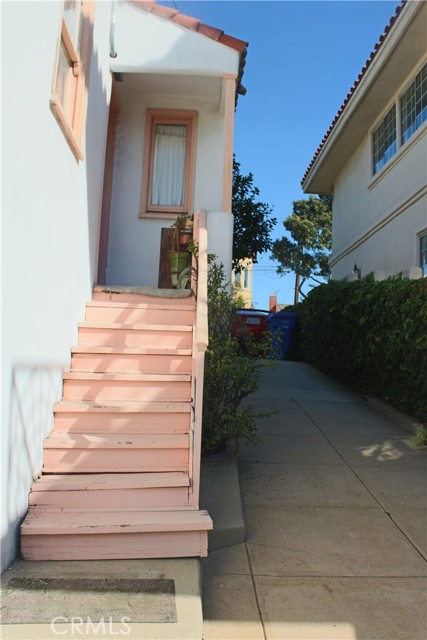 Stairs to the garages, laundry and utility area--FAU, hotwater heater and under the house pipes