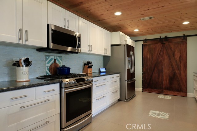 Large pantry behind those stylish barn doors