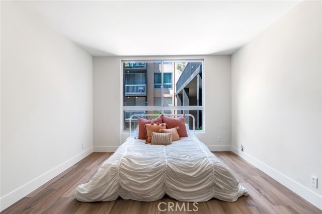 Spacious bedroom with window for natural light.