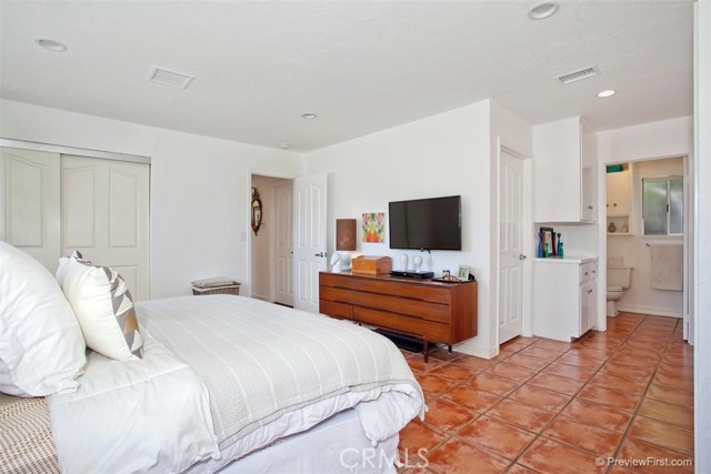 Bedroom #1 - primary suite.   Closet doors are now mirrored doors.  Also, there used to be a door connecting two rooms, but that is now a wall.