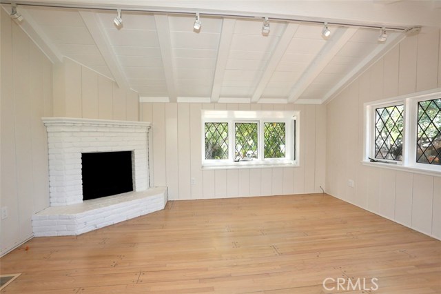 930 Catalina Street Laguna Beach, California BEAUTIFULLY REMODELED BEACH COTTAGE MOMENTS FROM DOWNTOWN LAGUNA BEACH! An absolutely stunning cottage on a quiet street in the heart of Laguna Village. This completely refurbished home boasts an unbeatable location within moments of several gorgeous beaches such as "Thalia Street" "Sleepy Hollow," and the nearby Bluebird PUBLIC PARK. The cottage features beautiful hardwood floors throughout, a light and bright kitchen with all new appliances and dutch door opening to patio. The very charming living room features open beam ceilings and a fireplace with gorgeous custom leaded-glass windows. The bedroom features cathedral ceilings, and mirrored closet. The all bath has brand new tiled shower and new vanity. Private enclosed patio, great for relaxing and outdoor dining. ENJOY STEPS to the nearby Ralph's shopping center as well as beaches, shops, and restaurants. THE IDEAL BEACH HOME IN LAGUNA!