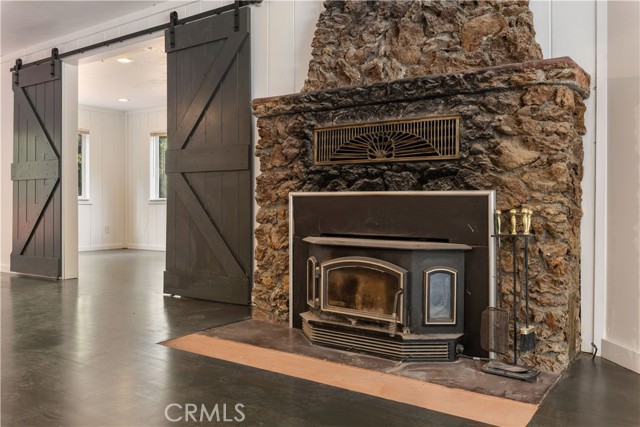 Stone fireplace with woodstove insert