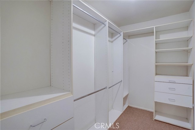 Built in shelves in walk in closet. Built in shelves in walk in closet.