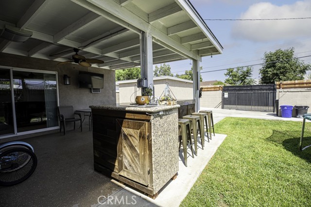 Backyard patio with outdoor bar - daytime