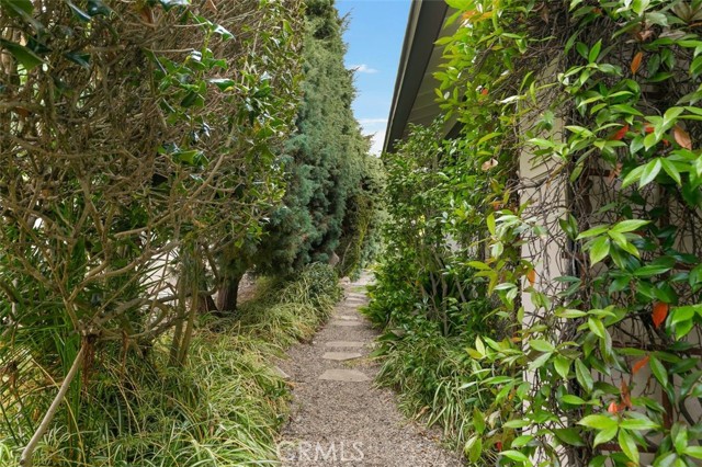 Pathways are located on both sides of the house.