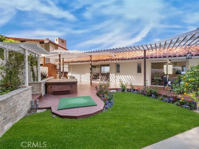 Backyard Spa and Grassy Area