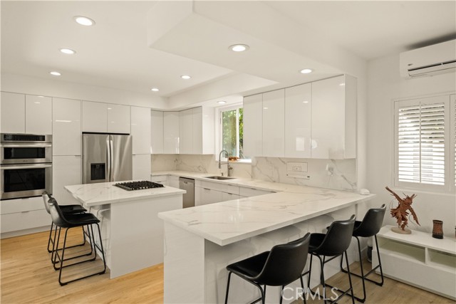 bar seating at peninsula for snacks, homework, socializing