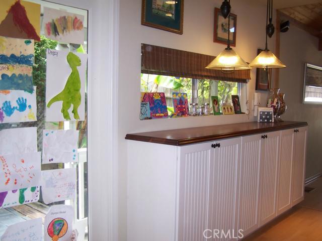 Brazilian Walnut Hosting Bar.  Simply open the window and All-Around Serving of Food and Beverage for Guests!