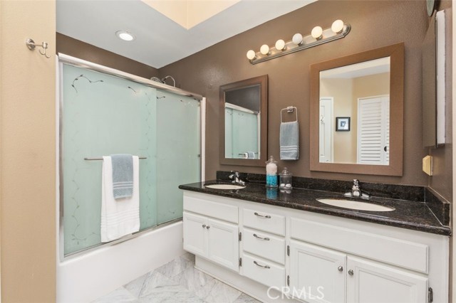 Primary bathroom with double vanities.