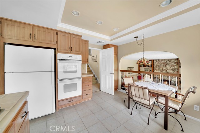 Kitchen and Eat-In Breakfast Nook that Overlooks a Warm and Inviting Family