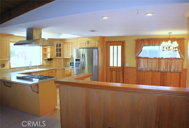 Remodeled kitchen with granite counters.