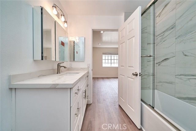 primary bathroom with shower and bathtub