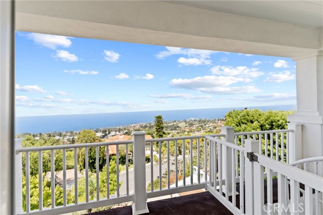 Private balcony wtih view of golf course and ocean.