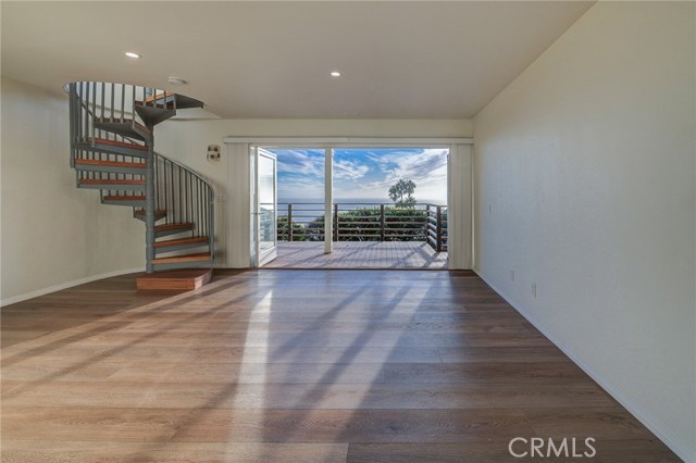 Stairs to the lower level bedroom, ensuite bath and laundry