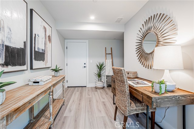 Ground Level multi-use Room for home office/workout/homework area. Garage access through door.