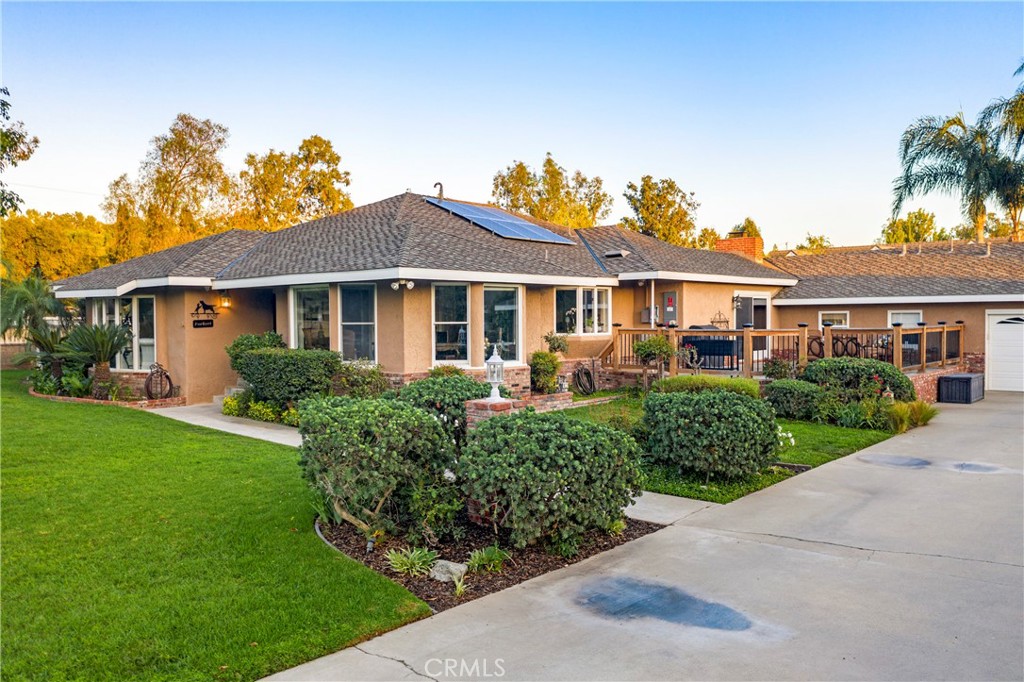 Front of home with side patio deck.