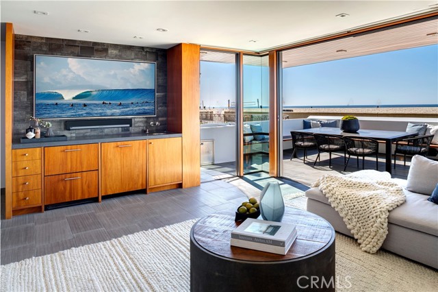 Downstairs living room and patio at The Strand level