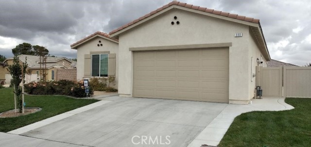 330 Scarlett Runner Beaumont, California LOVE WHERE YOU LIVE! The gorgeous open floor designed home is practically brand new. Many upgrades were completed to this home with minut wear & tear! This is a great time to make this your forever home. This Four Seasons Cornerstone Designed Home is on a large size corner. The home has great curb appeal featuring lavish green grass and beautiful corral colored rose bushes. In addition to all the upgrades, this home has an amazingly Large Island centrally located between the kitchen, dining, and living rooms. The kitchen has granite countertops, a butler's pantry, stainless steel appliances, which include dishwasher, microwave, stove/oven, and a gorgeous & functional French Door Refrigerator! The home has a centrally located gas fireplace visible to all in the main home areas & perfectly warms the home during cooler weather. The master bedroom is located in the back of the home and which allows for privacy and has an upgraded expanded window sitting area. The home includes gorgeous neutral wood flooring laminate throughout, 4 3/4" baseboards, and a calming neutral paint color. The backyard is fully landscaped and includes an enlarged patio cover.