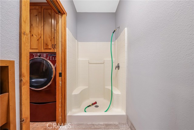 3/4 bath accessible from the garage and the laundry room.