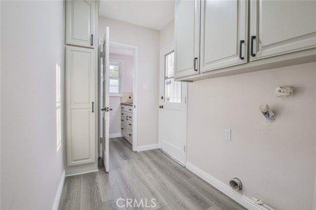 Water and Dryer hook-ups with cabinetry.