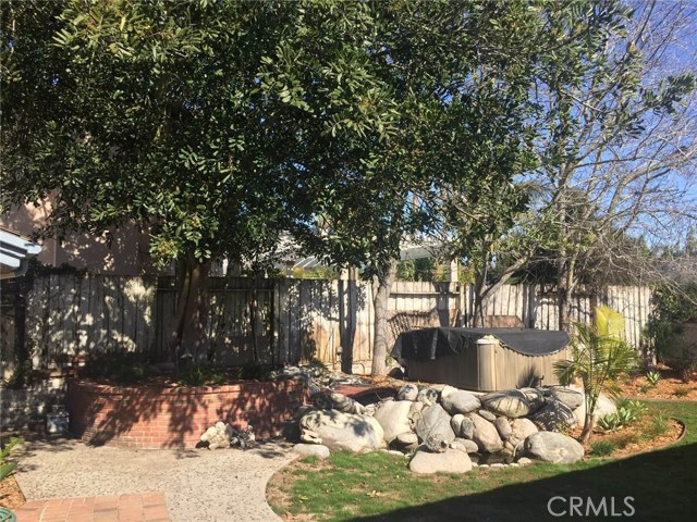 Elevated hot tub surrounded by mini moat, rear yard Elevated hot tub surrounded by mini moat, rear yard