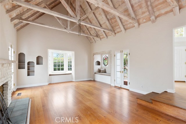 GREAT ROOM WITH HARDWOOD FLOORS CUSTOMR FIREPLACE, BEAM CEILINGS