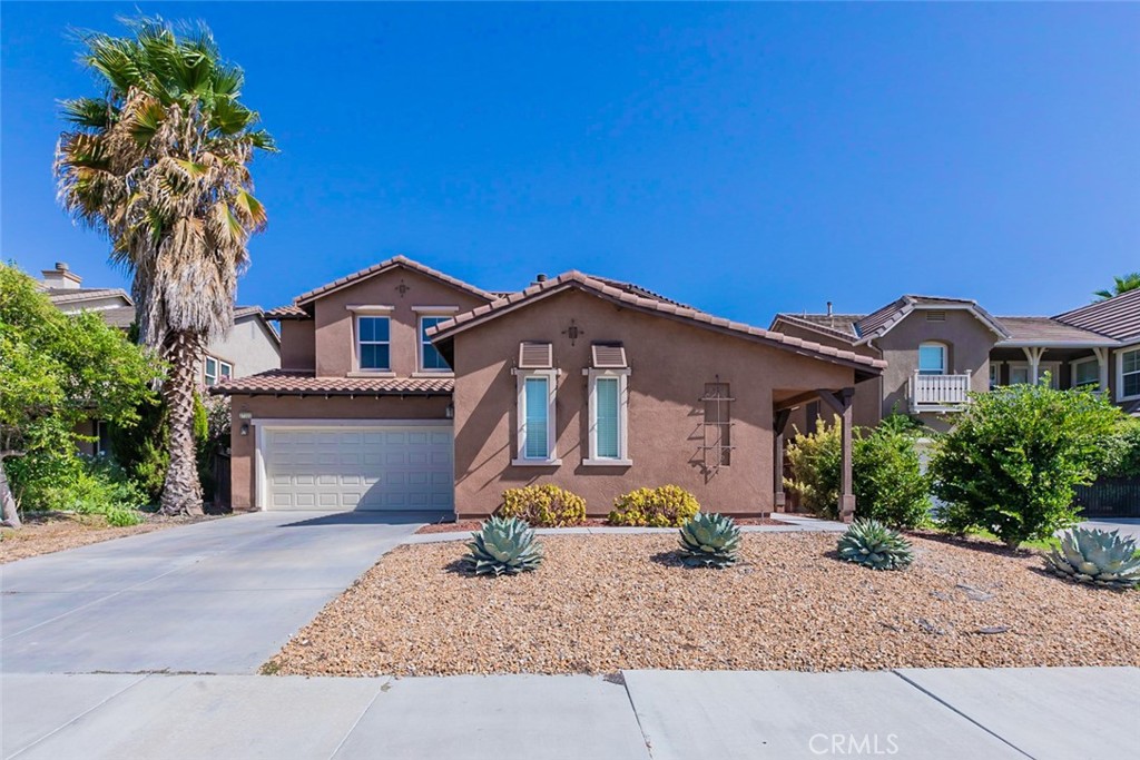 This Murrieta two-story home offers granite countertops, and a three-car garage.