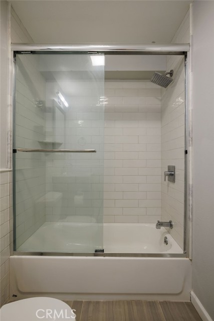 Primary bathroom with tub and shower