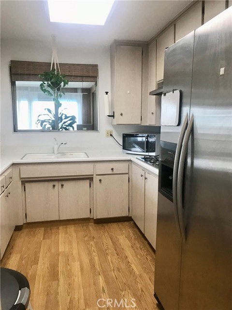 Airy kitchen with refrigerator included.