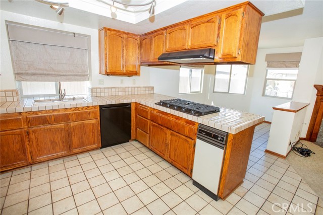 Kitchen: Refrigerator, Oven, Microwave, Dishwasher, Stove top w/hood, trash compactor