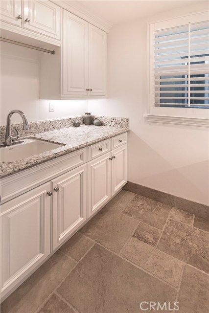 Laundry Room with sink, folding area and lots of storage