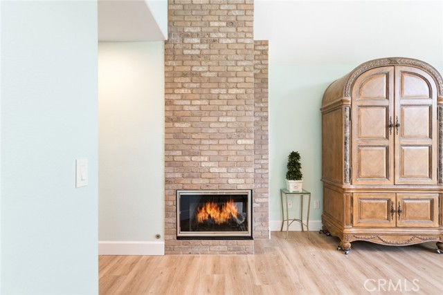 This beautiful brick fireplace goes from floor to ceiling and is perfect for those cold romantic evenings.